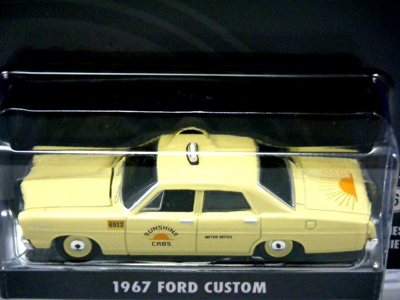 Greenlight Hollywood Series - Steve McQueen Bullitt -  1967 Ford Custom - Sunshine Taxi